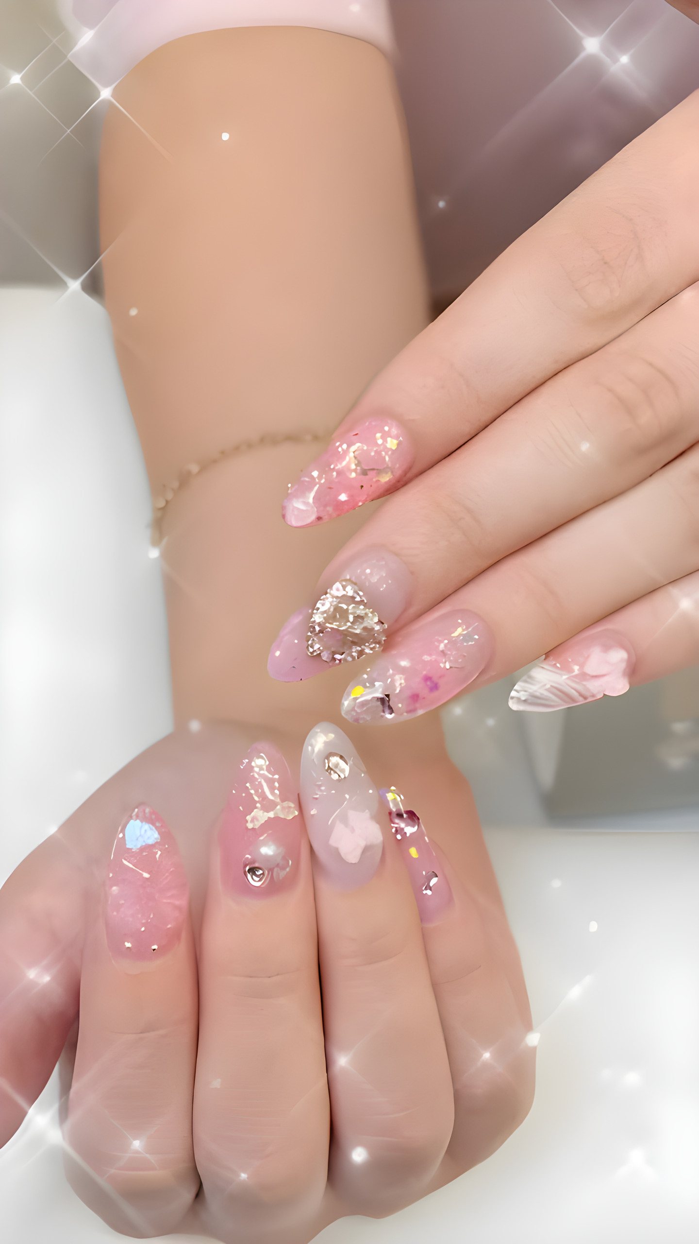 Pink jelly nails with crystals and 3D heart charms